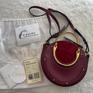 Chloe Burgundy Round Crossbody Bag with Gold Handle